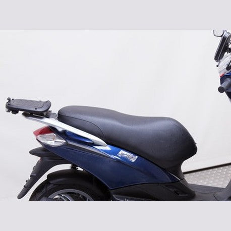 Fixation pour Top Case Piaggio Fly 125i - LE PRATIQUE DU MOTARD
