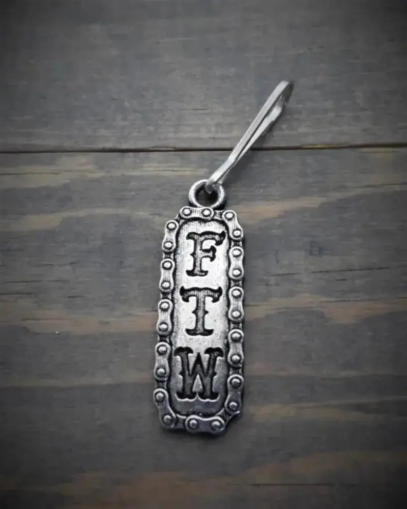 Tirant de fermeture éclair Bravo Bells " FTW" - Le Pratique du Motard